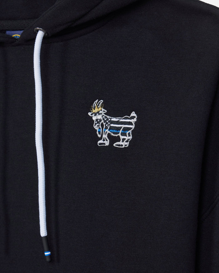 Close-up of a black hoodie featuring a white drawstring and a small embroidered goat mascot logo on the left chest, with blue and gold details.