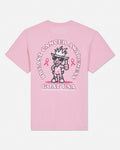 A light pink short-sleeve t-shirt shown from the back, featuring a large graphic print of a cartoon goat wearing sunglasses and a hat, surrounded by the text 'BREAST CANCER AWARENESS' and 'GOAT USA' with pink ribbons.