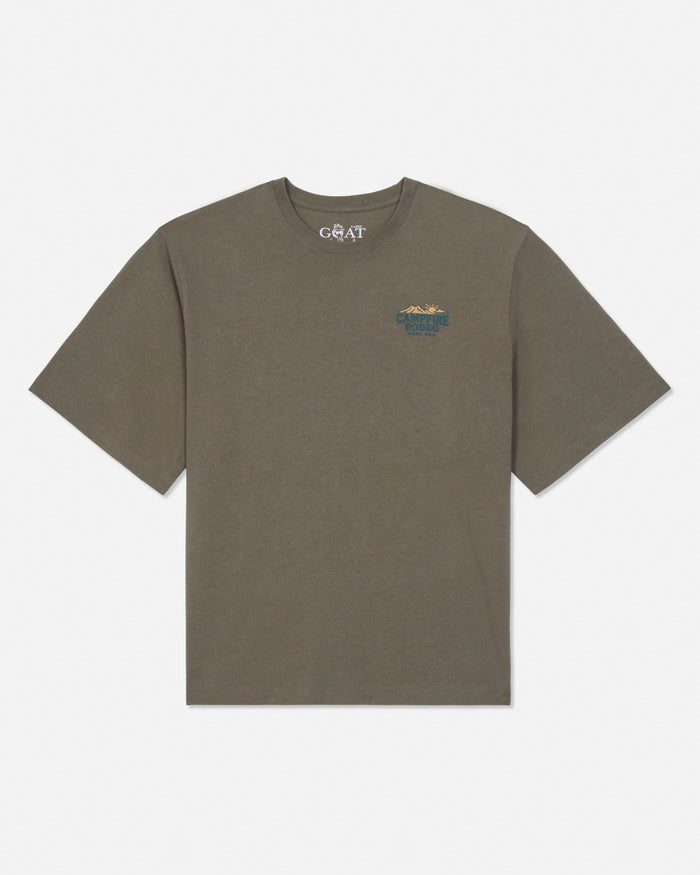 An olive green short-sleeve t-shirt with a small graphic on the left chest and a white 'GOAT USA' brand print inside the collar, displayed on a clean white background.