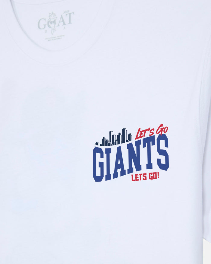 White short-sleeve t-shirt with a graphic on the chest reading 'Let's Go GIANTS Lets Go!' in red and blue, with a dark blue skyline silhouette above the word 'GIANTS'. The inner neck label shows the brand 'GOAT USA'.