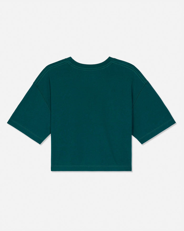 A dark green short-sleeve crop top shown from the back, laid flat against a light gray background.