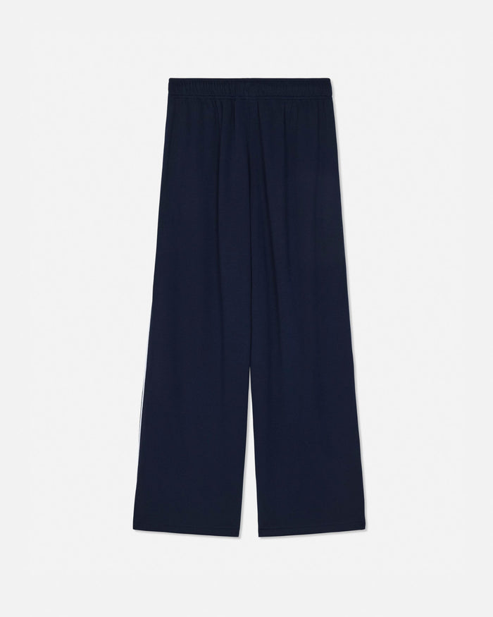 A pair of dark navy blue wide-leg trousers with an elastic waistband, shown flat against a light gray background.#color_navy-blazer