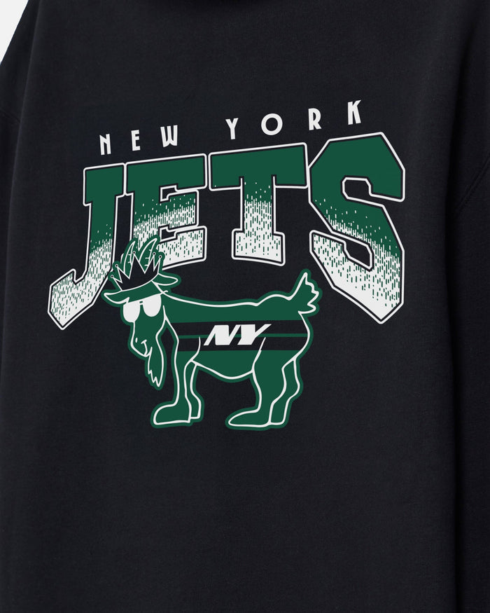 Close-up of a black sweatshirt featuring a green and white New York Jets graphic with the team name and goat logo.