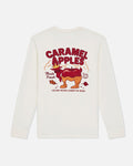 An off-white long-sleeve t-shirt shown from the back, featuring a colorful graphic of a caramel-apple character with the text 'CARAMEL APPLES' and 'STICKY NEVER LOOKED SO GOOD.' on a light gray background.