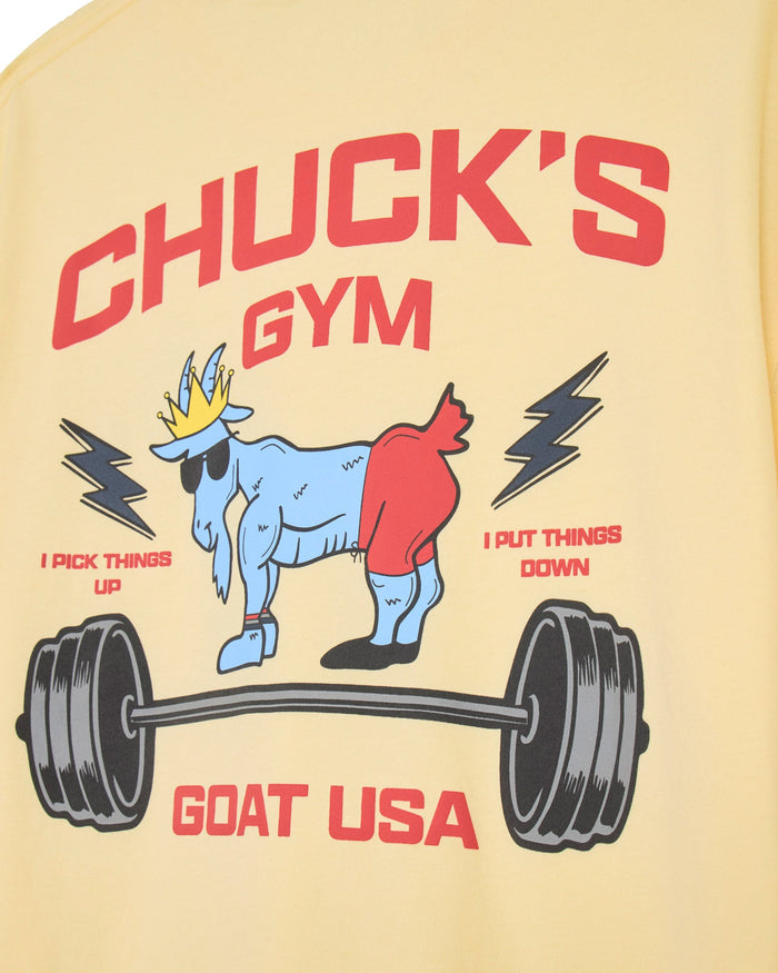 Close-up of yellow t-shirt with muscle goat and barbell graphic