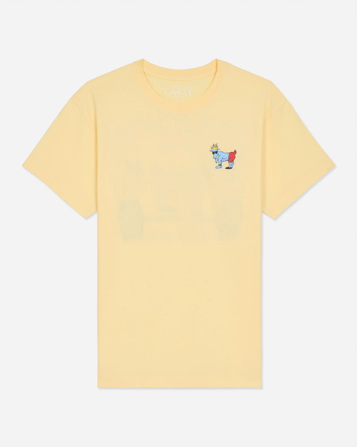 A pale yellow short-sleeve crewneck t-shirt with a small embroidered cartoon goat graphic on the left chest, displayed against a light gray background.