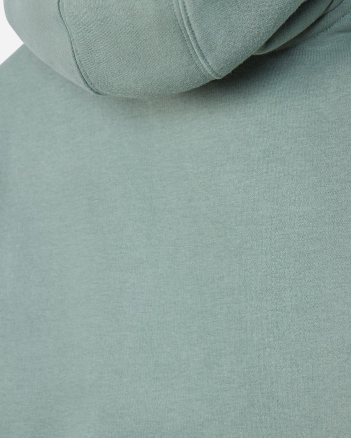 Close-up of a sage green hooded sweatshirt showing the fabric texture and hood seam.