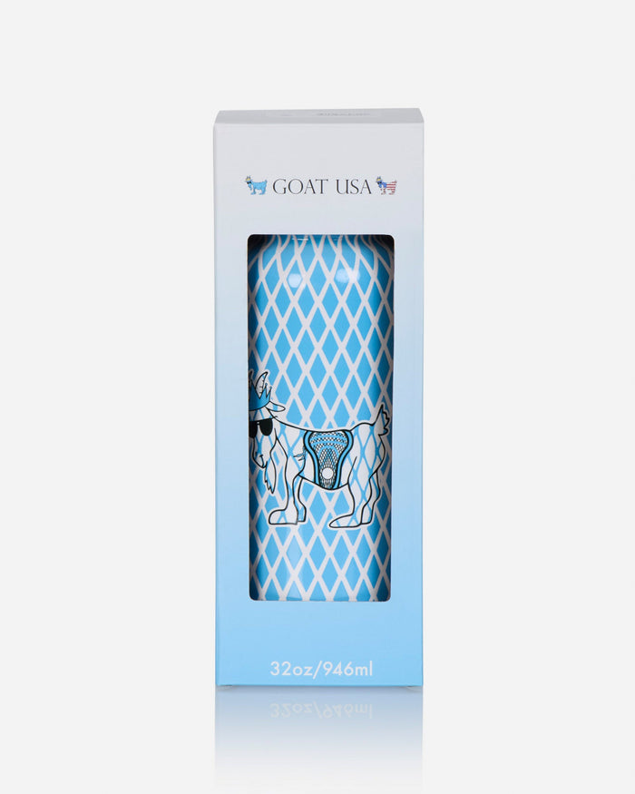 A tall, narrow white and light blue retail box with a clear window showing a cylindrical container printed with a blue diamond pattern and a goat illustration. The box is branded GOAT USA at the top and reads 32oz/946ml at the bottom, on a light gray background.