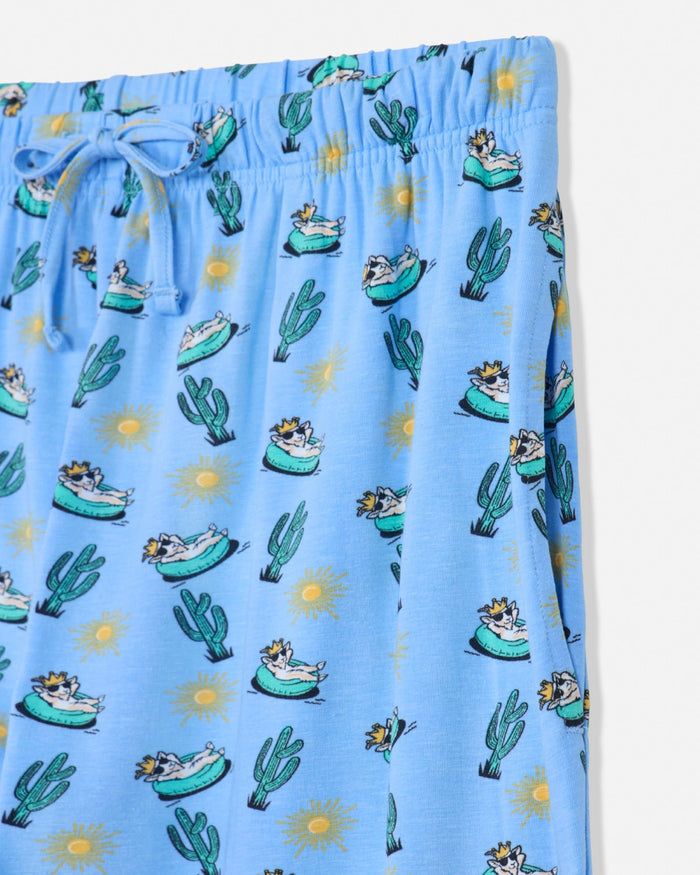 Carolina blue pajama pants with cactus and beach umbrella pattern on a white background