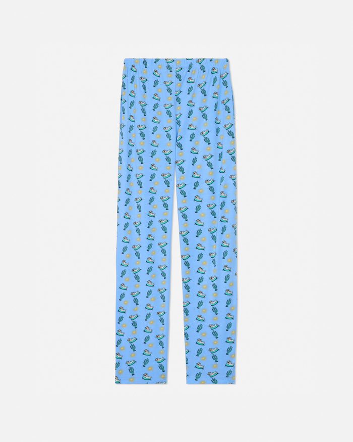 Carolina blue pajama pants with a pattern of small green plants on a white background