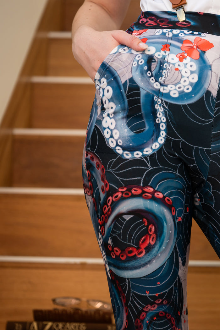 Slim fit cuffed pants with octopus tentacle illustration, ocean wave print and statement underwater design