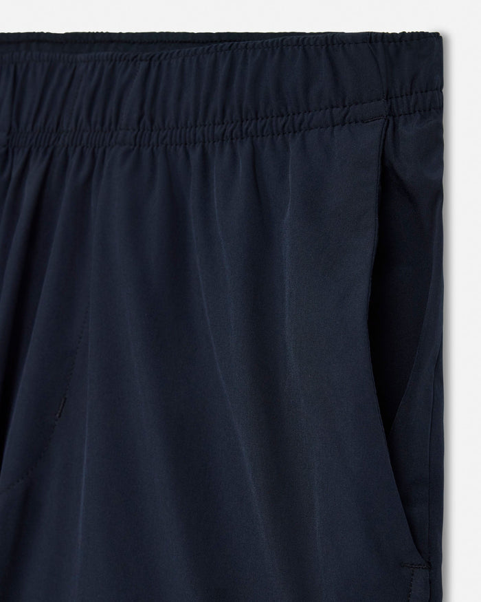 Close-up of black pants with an elastic waistband on a white background#color_black