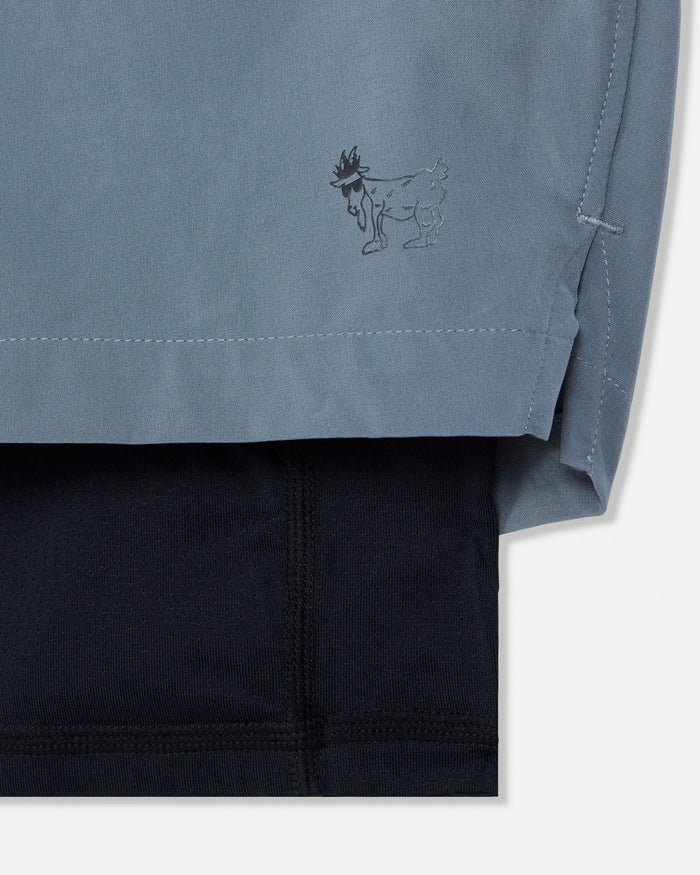 Close-up of a gray garment with a logo on a white background#color_storm-gray