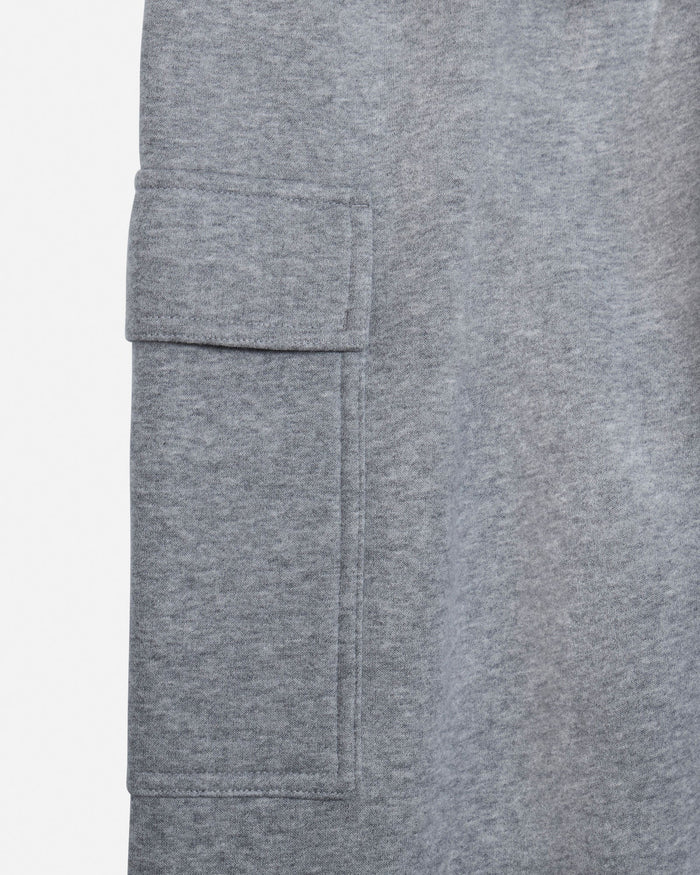 Close-up of a heather gray fabric garment showing a side cargo pocket and textured material on a white background.#color_gray-heather
