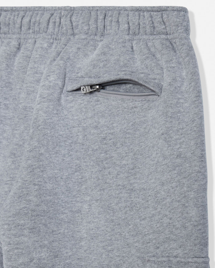Close-up of heather gray sweatpants showing the elastic waistband and a zippered side pocket.#color_gray-heather