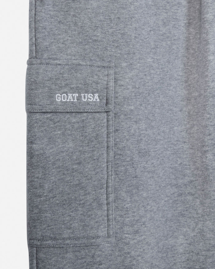Close-up of a heather gray fabric garment showing a side pocket with 'GOAT USA' embroidered in white on the pocket flap.#color_gray-heather