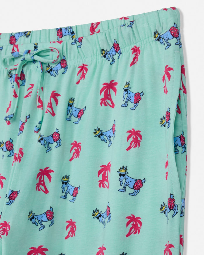 Mint pajama pants with colorful animal and palm tree pattern on a white background