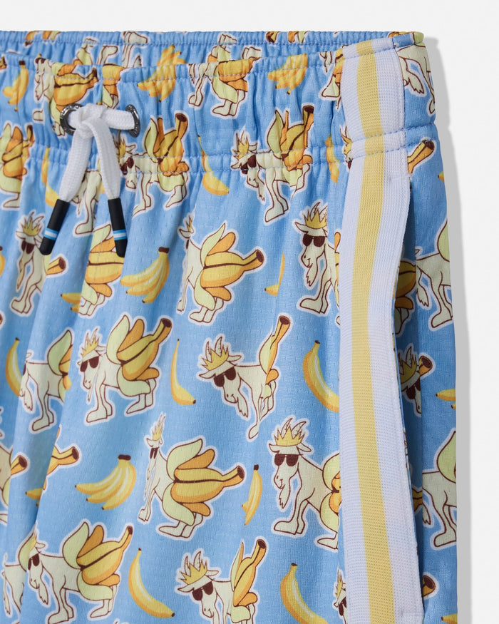 Close-up of light blue drawstring shorts with an all-over print of dancing bananas and cartoon figures, plus a white and yellow side stripe.