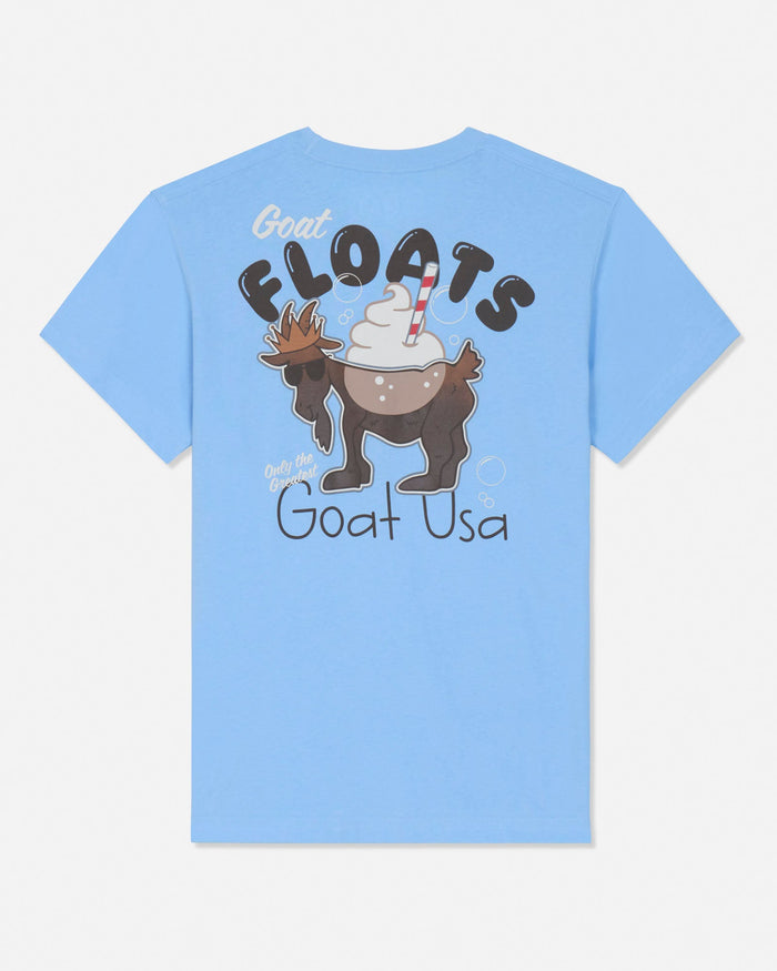 A light blue short-sleeve t-shirt with a graphic on the back featuring a cartoon goat wearing a hat with whipped cream and a red-and-white striped straw, under the words 'GOAT FLOATS' and above 'Goat USA'.