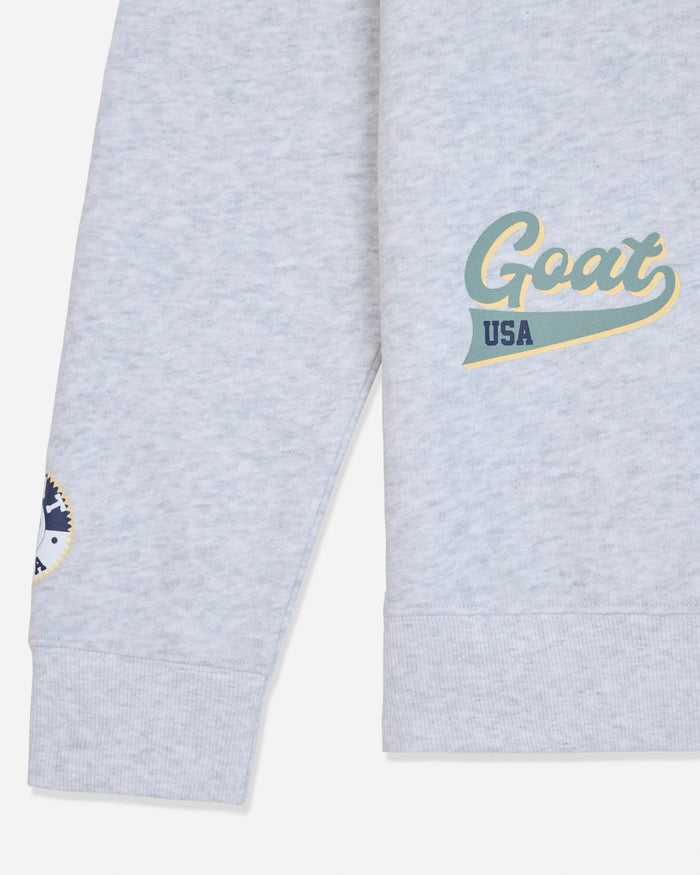 Sleeve of gray crewneck with patches