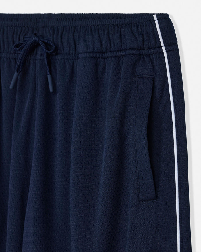 Close-up of navy blue athletic pants with a white side stripe, elastic waistband, and drawstring.#color_navy-blazer