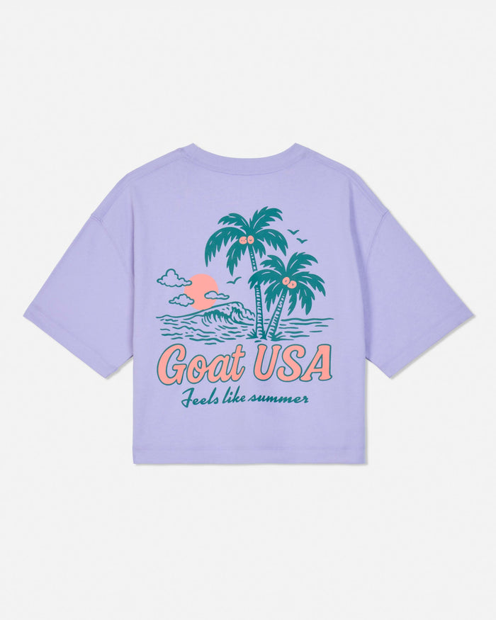 Periwinkle crop tee with palm tree and beach graphic on a white background